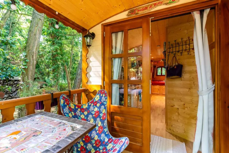 The door wide open onto the garden, seen from the terrace