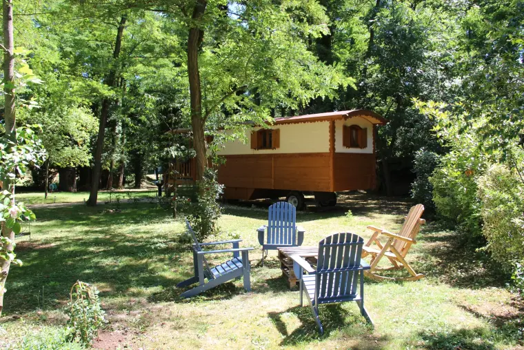 Deckchairs set out under the trees in the garden
